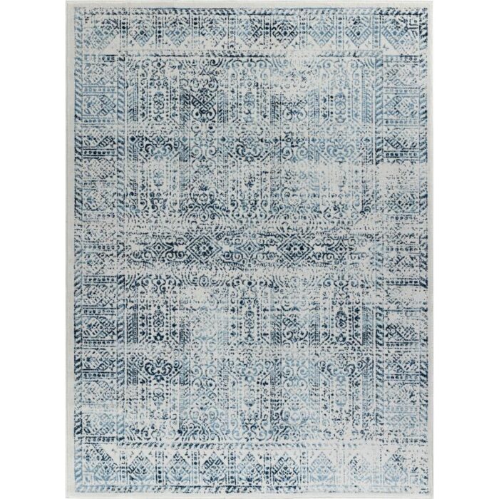 Tapis bleu et blanc à motifs traditionnels.