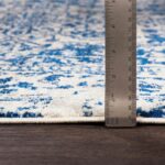 Règle mesurant l'épaisseur d'un tapis.