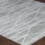 Tapis moderne gris avec motif géométrique.