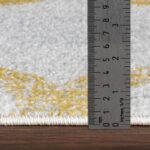 Épaisseur tapis mesurée réglette métallique