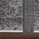 Règle mesurant épaisseur de tapis.