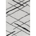 Tapis moderne gris avec motifs géométriques noirs.