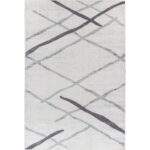 Tapis moderne gris avec motifs abstraits.