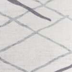 Texture murale abstraite en nuances de gris.