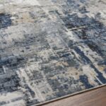 Tapis moderne aux motifs abstraits bleu et gris.