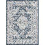 Tapis oriental bleu et blanc vintage.