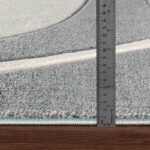 Règle mesurant épaisseur de tapis.