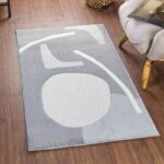 Tapis moderne gris abstrait dans salon.