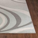 Tapis moderne à motifs ondulés gris.