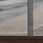 Règle mesurant l'épaisseur d'un tapis.