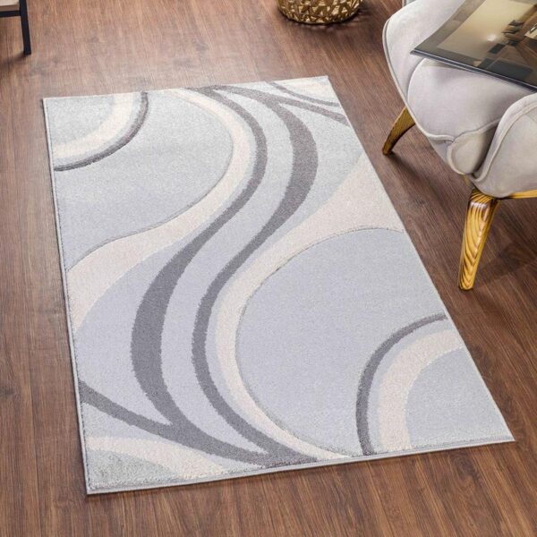 Tapis moderne aux motifs ondulés en gris.