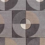 Carrelage géométrique en nuances de gris.