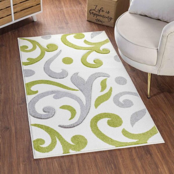 Tapis motif floral vert et gris intérieur.