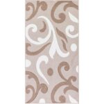 Tapis motifs arabesques beige et brun.