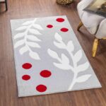 Tapis moderne motifs feuilles rouges et grises.