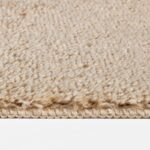 Tapis beige en gros plan, texture en laine.