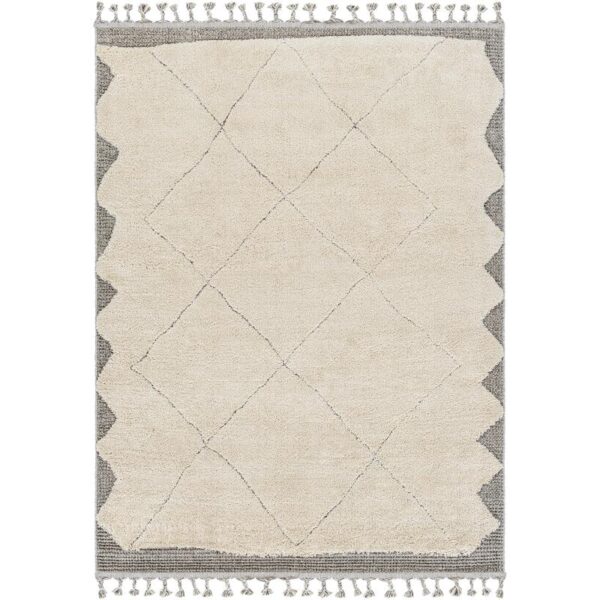 Tapis beige à motifs losanges et franges.