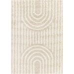 Tapis beige à motifs géométriques concentriques.