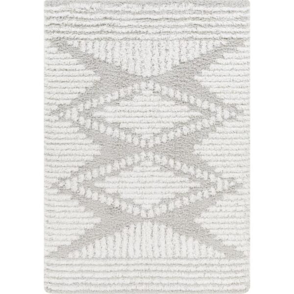 Tapis motif géométrique gris et blanc.
