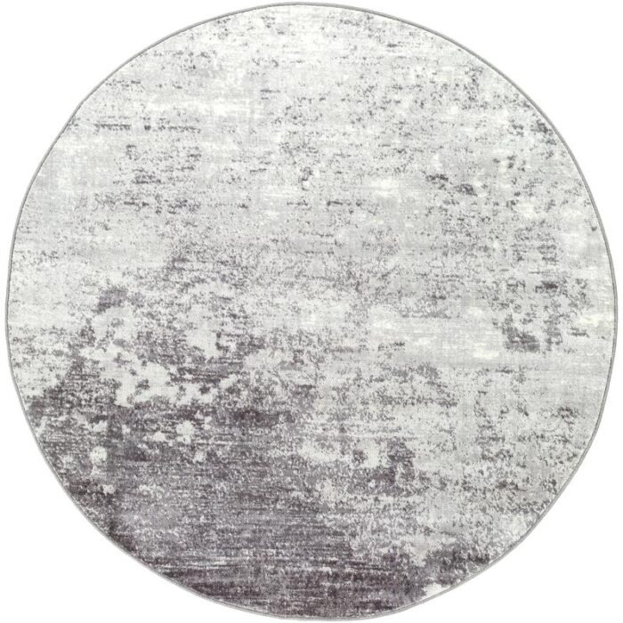 Tapis rond texturé gris et blanc.