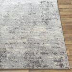 Tapis moderne gris et blanc texturé.