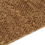 Moquette marron bouclée en gros plan.