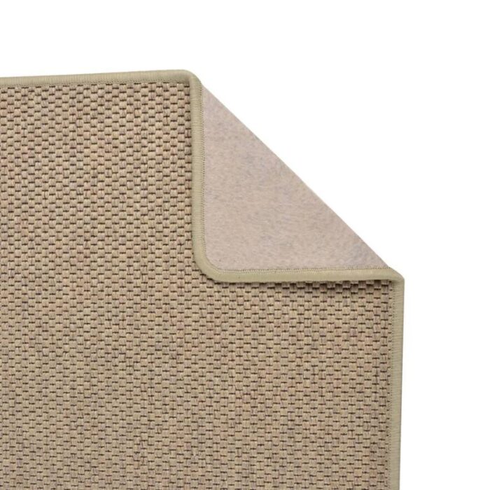 Tapis beige texturé en gros plan.