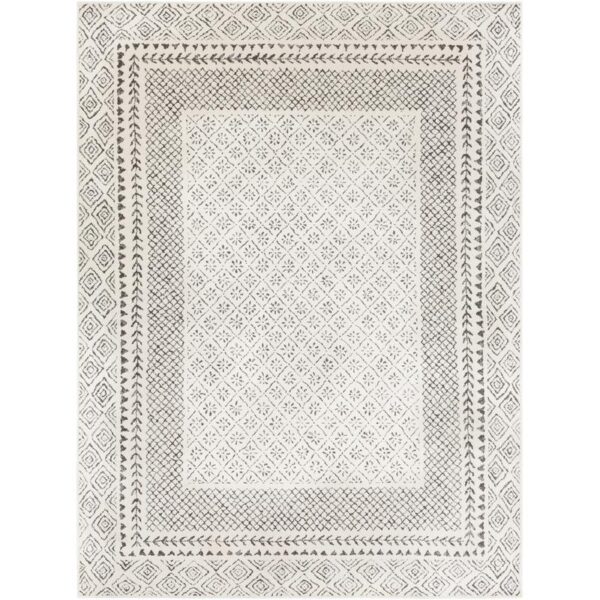 Tapis motif géométrique noir et blanc.