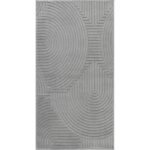 Tapis gris moderne avec motifs géométriques en relief.