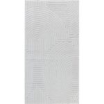 Tapis blanc texturé avec motifs géométriques circulaires.