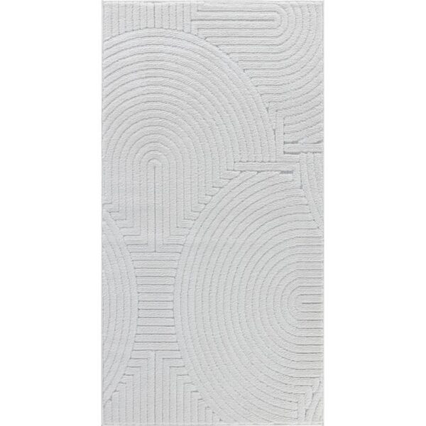 Tapis blanc texturé avec motifs géométriques circulaires.