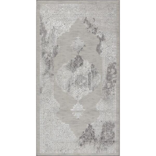Tapis gris avec motifs décoratifs élégants.