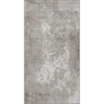 Tapis motif damassé gris et blanc.
