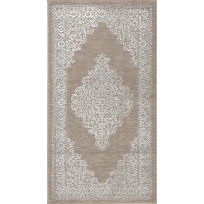 Tapis élégant à motifs dentelle beige.