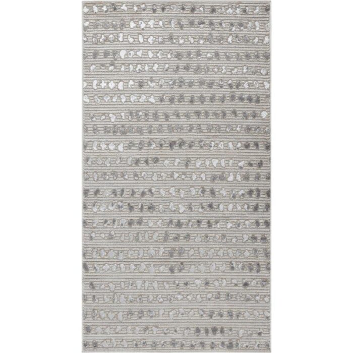 Tapis à motifs gris et blancs.