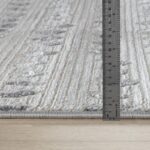 Règle mesurant l'épaisseur d'un tapis.