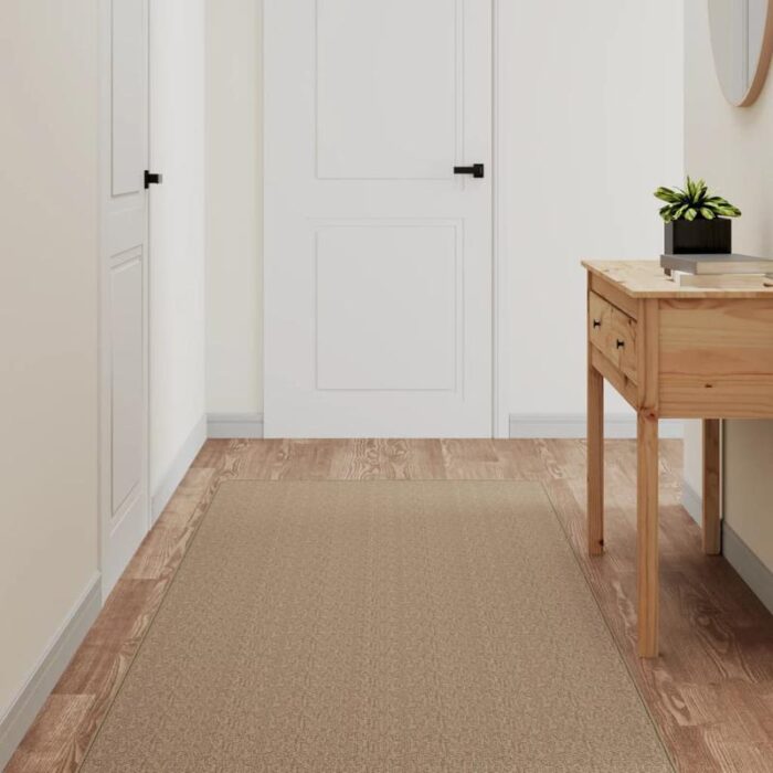 Entrée épurée avec console moderne et tapis beige.