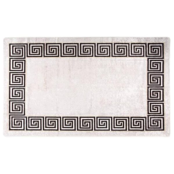 Tapis blanc à bordure noire motif grec.