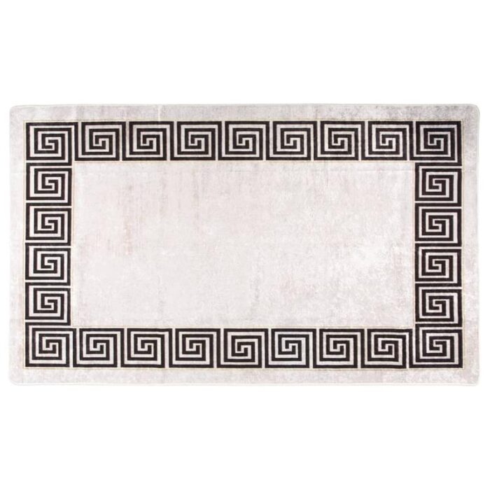 Tapis blanc à bordure noire motif grec.