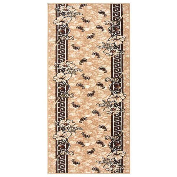 Tapis long motif floral et bordure grecque.