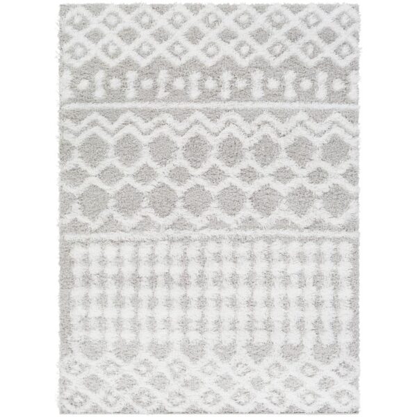 Tapis blanc à motifs géométriques pour intérieur moderne.