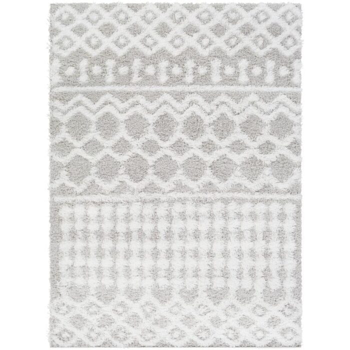 Tapis blanc à motifs géométriques pour intérieur moderne.