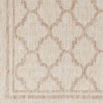 Tissu en damas beige avec motif géométrique.